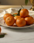 8 organic mandarines in a beautiful plate with luxury background